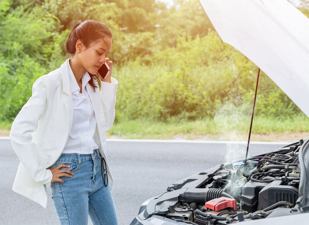 5 Tips for Car Insurance in Quincy, WA - Young Woman Calling Help and Insurance Auto Service With a Problem Broken Car on the Road